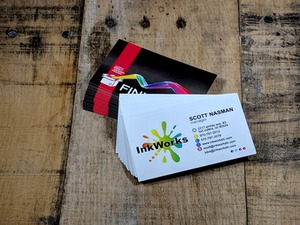 Business Cards displayed on a wooden table